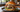 Trüffelburger mit Bacon, geschmolzenem Käse, Rucola und Dollie Trüffel Mayo